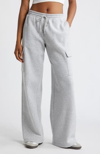 Cargo pockets and wide legs make these fleecy sweatpants right on trend for cool weather and days when you just want to be cozy. 32" inseam; 32" leg opening; 12 1/2" front rise; 13 1/2" back rise (size medium) Elastic/drawstring waist Side flap-patch pockets 68% cotton, 32% recycled polyester Machine wash, tumble dry Imported Not available for sale and shipment to Germany Sweatpants Aesthetic, Cute Sweatpants Outfit, Cute Sweatpants, Fall Pants, Spring Break Outfit, Sweatpants Outfit, Wide Leg Sweatpants, Cool Weather, Fire Fits