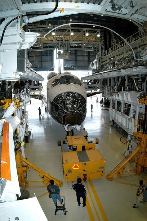 Workers prepare to tow Space Shuttle orbiter Atlantis from the OPF to the VAB. The move will allow work to be performed in the OPF that can only be accomplished while the bay is empty. Atlantis will remain in the VAB for about 10 days, then return to the OPF as work resumes to prepare it for launch in Sept 2004 on the first return-to-flight mission, STS-114. 12/05/2003. Credit: NASA Nasa Internship, Aircraft Maintenance Engineer, Aviation Engineering, Nasa Engineer, Aerospace Design, Nasa Space Program, Space Engineers, Space Camp, Nasa Space Shuttle