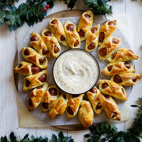 Give the classic pigs in a blanket a bit of Christmas cheer by baking them in a wreath and serving them with a delectable maple-mustard dipping sauce. Pigs In A Blanket Wreath, Wreath Recipe, Honey Roasted Carrots, Mustard Dipping Sauce, Christmas Sides, Christmas Side Dishes, Maple Mustard, Hot Appetizers, Christmas Lunch