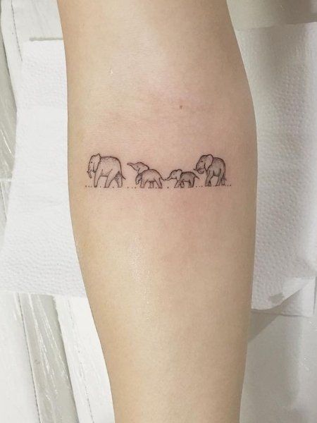 23 Meaningful Family Tattoos That Show Your Love- The Trend Spotter Small Tattoos For Family Symbols, Tattoos For A Family Of Four, Small Mother Tattoos Simple, Tattoo Family Of 3, Tattoos For Families, Family Micro Tattoo, 4 Generation Tattoo Ideas, Tattoos For Your Family, Tattoo Ideas For Family Of 3