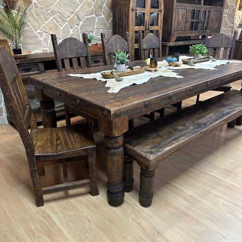 The Legendary all time best selling Ponderosa Dining Set Now in 8' length. 100% Solid Wood Construction, this table is build to last! Finished in a dark wax stain and accented with metal nail heads, The Ponderosa 8' will be a perfect fit for those looking for a large table set in a timeless rustic style. Choose from all 8 chairs or 5 chairs and a bench! Western Living Room, Rustic Kitchen Tables, Rustic Dining Room, Living Comedor, Table Sets, Solid Wood Table, Farmhouse Dining Room, Rustic Table, Farmhouse Dining