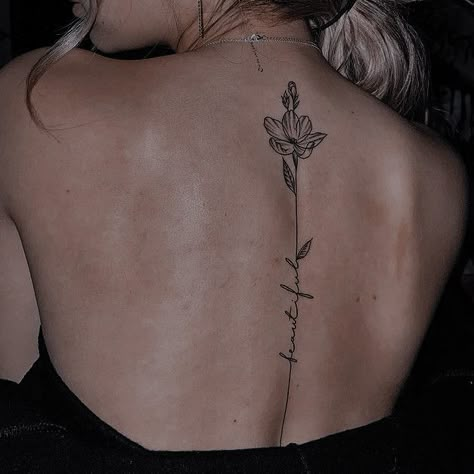 Single Flower Spine Tattoo, Flower Spine Tattoos For Women Quotes, Spine Tattoos For Women Western, Upper Spine Tattoos For Women, Lower Spine Tattoos For Women, Lily Spine Tattoo, Western Spine Tattoo, Western Spine Tattoos For Women, Back Tattoo Women Spine