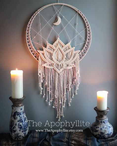 This beautiful wall hanging design features a lotus blossom design made using macrame rope-knotting techniques, framed by a cotton-covered a double hoop. The moon pendant is carved from shell and measures 7cm in height. The main beads are pink-zebra jasper with a frosted (matte) finish in light shades of pink, grey, and white, accessorised with small clear glass and sliver coloured metal beads.  This mandala has been handwoven using high quality Makrame Wall Art, Unique Macrame Ideas, Macrame Mandala Tutorial, White Macrame Wall Hanging, Macrame Projects Ideas, Dream Catcher Macrame, Dreamcatcher Macrame, Wall Hanging Design, Macrame Light