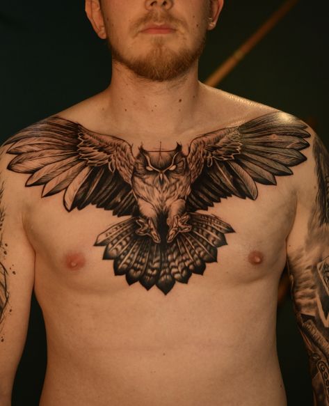 A tattoo idea for a man could be an owl design on the chest. Owls are often associated with wisdom and mystery, making them a popular choice for tattoos. The chest is a great location for a tattoo as it provides a large canvas for intricate designs.      Tattoo Idea Szczecin Poland Owl Animal Spiryt Owl Chest Tattoo Men, Owl Throat Tattoo, Chest Tattoo Man, Bird Chest Tattoo, Owl Tattoo Chest, Szczecin Poland, Owl Animal, Throat Tattoo, Chest Tattoo Men