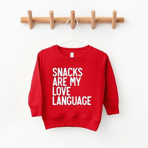 Looking for a cute sweatshirt for your kids? We have the perfect Snacks Are My Love Language graphic sweatshirt addition to their closet! Also available in youth sweatshirts. Holiday Sweatshirt Ideas, Playful Red Cotton Sweatshirt, Playful Red Sweatshirt For Fall, Playful Long Sleeve Sweater With Letter Print, Toddler Cricut Shirts, Cricut Sweatshirt Ideas, Perfect Snacks, Cricket Projects, Sporty Street Style