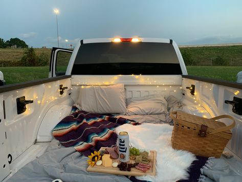 Picnic Truck Bed, Date Night Back Of Truck, Back Of Pickup Truck Date, Truck Box Date Night, Blankets In Truck Bed Date, Trunk Sunset Date, Truck Bed Date Romantic, Back Of Truck Picnic, Back Of Truck Movie Night