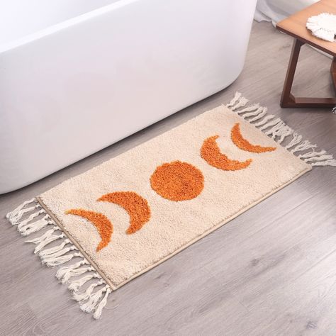 PRICES MAY VARY. BOHO BATHROOM RUG - our moon phase bath rugs in natural taupe color with burnt orange half moon are essential for bathroom or college dorm room decor; whether you like bohemian style, witchy, hippie or other urban outfitters decor, or need a dorm rug BOHO RUGS - 31.5 x 20 long is a perfect size for your bohemian bathroom, boho bedroom decor, bedside rug, kitchen, nursery, laundry room or elsewhere in your home NON SLIP TPR BACKING - our moon boho bathroom rugs have a rubber on t Teal Bathroom Rugs, Urban Outfitters Decor, Boho Bathroom Rugs, Boho Bathroom Rug, Dorm Rug, Rug With Tassels, Earthy Bathroom, Large Bathroom Rugs, Moon Rug