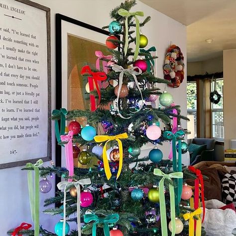 Ali Edwards on Instagram: "Colorful, festive + fun ⭐️. I have so loved switching things up with our tree this year. Most years our tree is a combination of ornaments from my childhood (and others collected throughout my life) and ornaments the kids have collected over the years along with white twinkle lights. I have always loved the nostalgia of that set up + revisiting the stories that go along with so many of those ornaments and I’m sure I’ll do that again in the future. This year I decided to do something completely different (initially inspired by Anna’s request for colorful lights + supported by my 2023 #onelittleword “joy”) and went with a couple boxes of colorful ball ornaments, colored lights, and velvet ribbon tied in bows. I’m so glad Anna pressed + planted that seed to mix thin White Christmas Tree With Colorful Decor, Colorful Christmas Tree With Ribbon, Colorful Ornaments Christmas Tree, Colored Lights Christmas Tree Decorating, Christmas Tree With Velvet Ribbon, Colored Lights Tree, Bright Colored Christmas Tree, Velvet Bows On Christmas Tree, Kid Friendly Christmas Tree