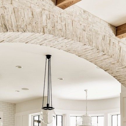 Swan Architecture on Instagram: "The whitewashed brick arch that frames the kitchen was a detail our client had seen and loved in a California house, and was built and color-matched to her specifications. It is definitely a unique detail and we truly embrace when our clients come to the table with strong design ideas - and it actually helps us to design the rest of the house as well.  It is truly a collaborative process.⠀⠀⠀⠀⠀⠀⠀⠀⠀ ⠀⠀⠀⠀⠀⠀⠀⠀⠀ ⠀⠀⠀⠀⠀⠀⠀⠀⠀ ⠀⠀⠀⠀⠀⠀⠀⠀⠀ ⠀⠀⠀⠀⠀⠀⠀⠀⠀ ⠀⠀⠀⠀⠀⠀⠀⠀⠀ #lovewhereyoulive⠀⠀⠀⠀⠀⠀⠀⠀⠀ #foxstreetfarmhouse" White Brick Archway, Stone Arch In Kitchen, Arch In Kitchen, Come To The Table, Whitewashed Brick, Brick Archway, Above Sink, White Wash Brick, California House