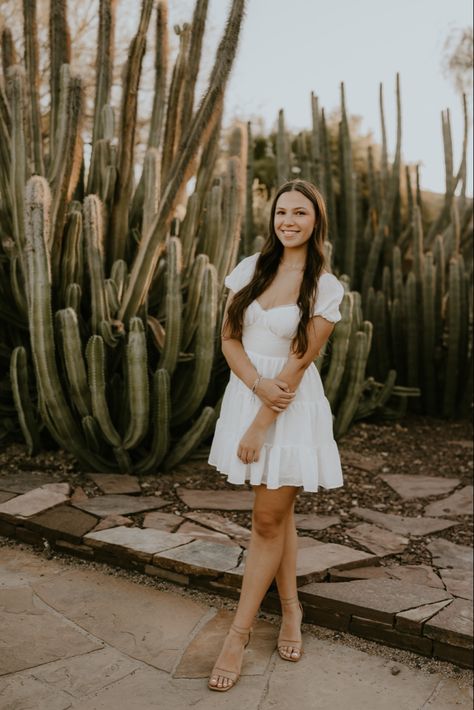 senior pictures with cactus in the background in phoenix arizona at the desert botanical gardens Desert Botanical Garden Arizona Photoshoot, Cactus Senior Pictures, Desert Photoshoot Poses, Mexico Senior Pictures, Desert Botanical Garden Photoshoot, Senior Pictures In Arizona, Desert Grad Photos, Senior Pictures Desert, Senior Photos Desert