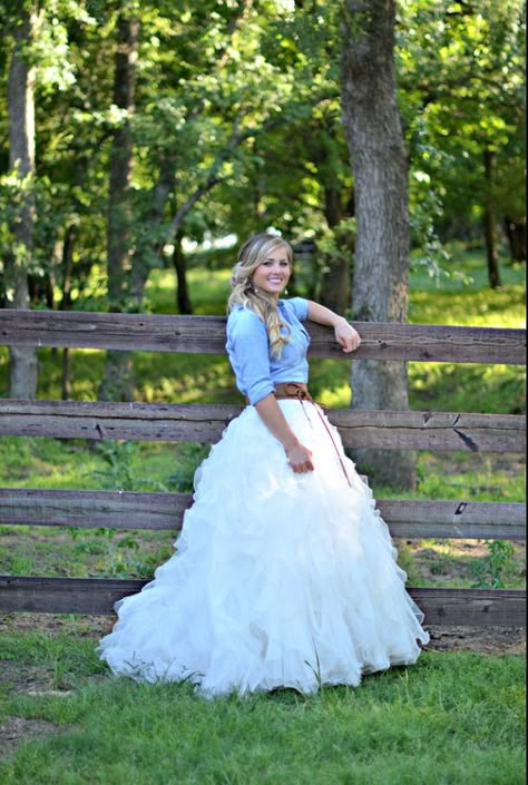 Blue jean shirt with white wedding skirt Chambray Wedding Dress, Wedding Dress With Flannel Shirt, Blue Jean Wedding Dress, Wedding Dresses With Jean Jackets, Blue Jean Wedding Attire, Flannel With Wedding Dress, Flannel Shirt Wedding Dress, Jean Jacket Wedding Dress, Country Style Wedding Dresses With Boots