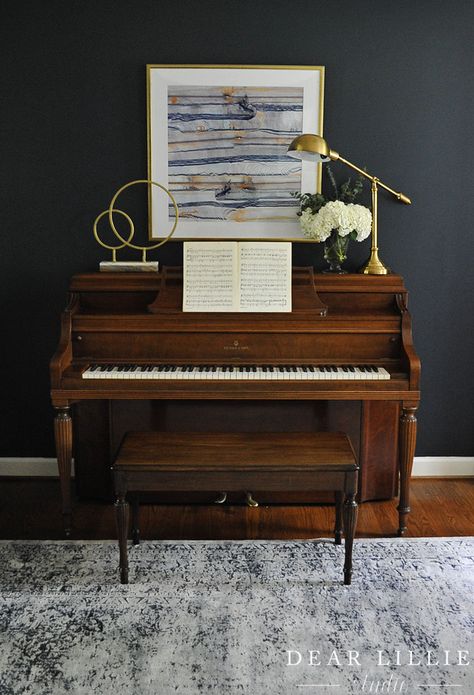 Adding some modern touches like this gold scupture and reading lamp from HomeGoods helps too balance out the traditional feel of the piano and give it an updated look. (sponsored pin) Light Colored Sofa, Piano Room Decor, Piano Living Rooms, Piano Decor, Piano Lamps, Dear Lillie, Piano Room, Upright Piano, Grand Piano