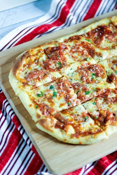 Golden crust pizza homemade on a sheet pan in the oven. An easy pizza recipe for kids, weeknight meals, and Italian pizza nights. | sipbitego.com #pizza #dinner #recipes #dough #pizzadough #italianfood #easyrecipe Store Bought Dough, Kids Pizza Recipes, Making Pizza At Home, Sheet Pan Pizza, Store Bought Pizza Dough, Pizza Homemade, Pizza Dinner, Best Homemade Pizza, Pizza At Home