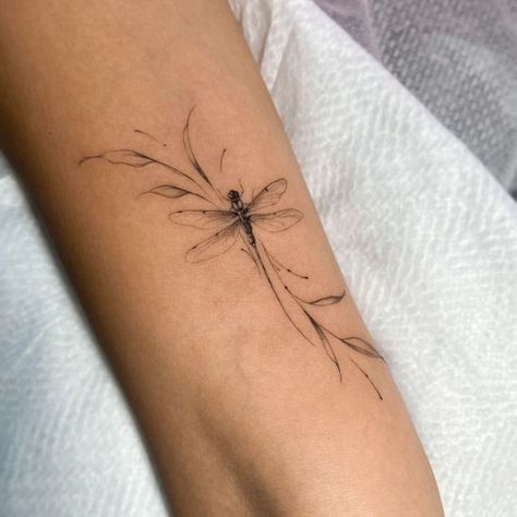 Fine line dragonfly tattoo on forearm Feather Flowers Tattoo, Dragonfly Tattoo Elbow Crease, Tiny Dragonfly Tattoo Simple, May Fly Tattoo, Small Dragonfly Tattoo Semicolon, Dragonfly Bracelet Tattoo, Feminine Fine Line Tattoo Ideas, Animal Tattoos Fine Line, Water Lily And Dragonfly Tattoo