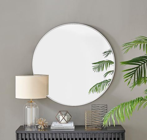 The Emma mirror is a stylish on trend design with its round shape and minimal metal frame, it will have a high impact on your walls. Wow your guests with the ultimate circle mirror
This is an extra large round wall mirror measures 100cm, so it really is a very big mirror. The Emma 100cm mirror will really claim its space on your wall and become a centrepiece of the room
The white metal frame of this stylish round mirror is a subtle design which frames this large mirror perfectly. Round Mirror Design, Large Round Wall Mirror, White Mirror Frame, Large Round Mirror, Mirror Dining Room, Mirror Collection, Gold Framed Mirror, Gold Frame Wall, Mirror Wall Living Room