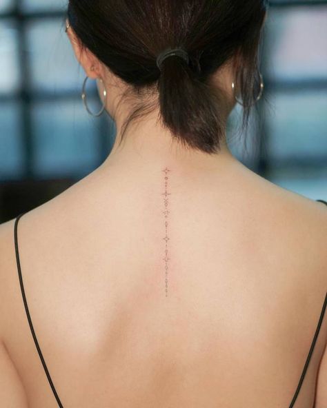 Small Fine Line Back Tattoo Women, Back Of Neck Spine Tattoo, Subtle Spine Tattoos For Women, Fine Line Back Of Neck Tattoo, Spine Star Tattoo, Star Tattoo Spine, Symbol Chain Tattoo, Spine Tattoos For Women Fine Line, Spine Tattoo Stars