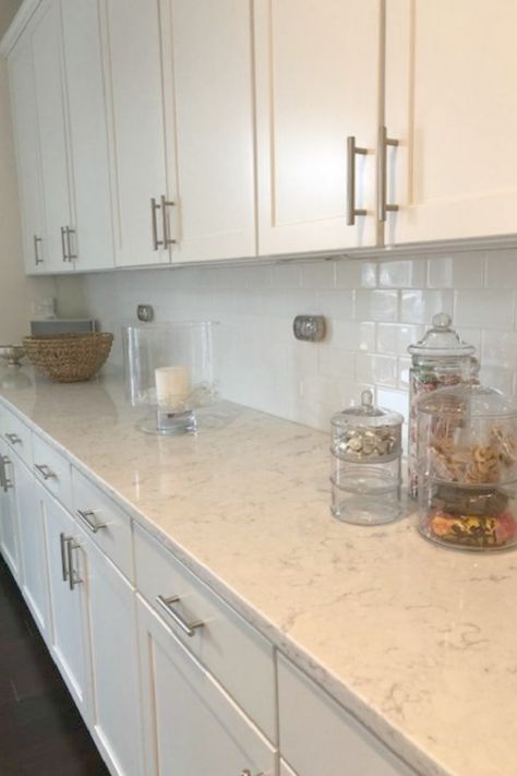 White kitchen with Viatera Minuet quartz countertops - Hello Lovely Studio. White Kitchen Cabinets With Beige Quartz, White Cabinets With White Quartz Counter, Short Quartz Backsplash, Kitchen Countertops With White Cabinets Quartz Carrara Marble, Quartz Counter Tops With White Cabinets, White Kitchen Counters Quartz, White Counter Tops With White Cabinets, Ventina Quartz Countertops, Stonemark New Carrara Marmi Quartz