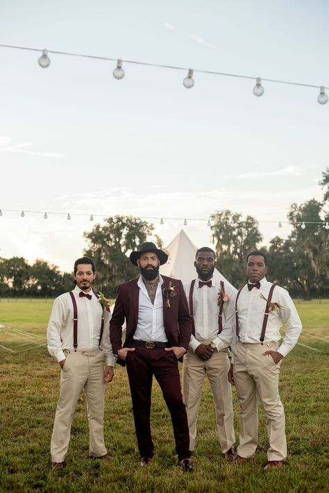 Groom and groomsmen at a glamping-themed, music festival-inspired wedding styled shoot at a rustic ranch venue. #groom #groomsmen #boho #bohostyle #bohowedding #rusticwedding #styledshoot Rustic Wedding Suits Groom Style, Desert Groom Attire, Beige Groom Black Groomsmen, Boho Groomsmen Attire Bohemian, Mixed Groomsmen Suits, Groom Suit Boho, Bohemian Groom Attire, Boho Mens Wedding Attire, Mens Outdoor Wedding Attire