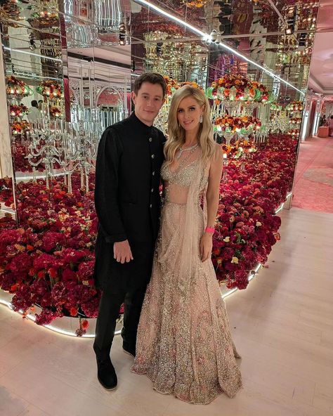 Stunning @nickyhilton in "Shyna" Cocktail Lehenga Set for #ambaniwedding Blush pink shimmer tulle cocktail lehenga with a tulle blouse and drape dupatta. Lehenga embellished with sequins and cut Dana embroidery. Available at Delhi and Mumbai stores #ambani #ambaniwedding #basra #indianbride #dollyjstudio #weddinggown #weddinginspo #dollyjbride #dollyjlehenga #dollyjgown #couture #bridalgown #wedmegood #lehenga #dollyj #summercollection #bridalgowns #springsummerfashion #couturefashion #sp... Shimmer Lehenga Sequins, Cocktail Lehenga, Drape Dupatta, Shimmer Lehenga, Tulle Blouse, Nicky Hilton, Indian Bride, Couture Fashion, Spring Summer Fashion