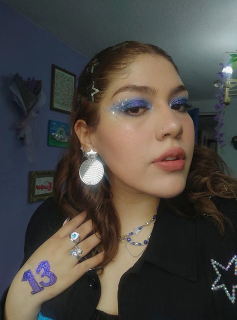 Melissa Hego ✨ Taylor Swift Eras Tour Midnights Era makeup inspired blue glitter and stars ⭐ Midnight Make Up Taylor Swift, Midnights Taylor Swift Aesthetic Makeup, Taylor Swift 1989 Inspired Makeup, Taylor Swift Inspired Eye Makeup, Taylor Swift Midnights Era Makeup, Midnights Era Makeup Ideas, Midnights Outfit Taylor Swift Ideas, Taylor Swift Midnights Inspired Makeup, Midnight Taylor Swift Makeup