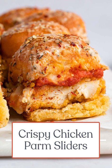 These incredible chicken parm sliders are the perfect appetizer or entrée for parties, showers, game days, or anytime you want something delicious and bite-sized. Crispy chicken strips are topped with rich marinara and melted provolone, sandwiched between dinner rolls covered in a seasoned butter-parmesan sauce. Chicken Parm Sliders, Parm Sliders, Crispy Chicken Strips, Chicken Parmesan Sliders, Baked Chicken Strips, 40 Aprons, Slider Sandwiches, Chicken Patties, Chicken Parm