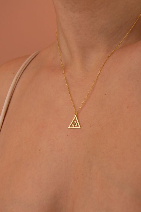 Chic gold necklace featuring a minimalist triangle pendant, symbolizing modern elegance and simplicity. Trendy Triangle Gold Jewelry, Dainty Gold Triangle Jewelry, Cheap Gold Triangle Jewelry, Elegant Gold Triangle Necklace, Minimalist Triangle Metal Necklace, Trendy Fashion Jewelry, Triangle Necklace, Triangle Pendant, 14k Gold Necklace