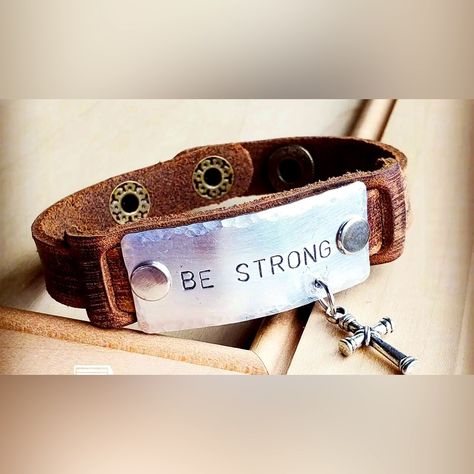 Be Strong Hand-Stamped Metal Plate With A Small Silver-Tone Cross Hanging From The Side Attached To A Genuine Leather Hand-Distressed Cuff With Rivets Entire Bracelet Length Is 1” By 7.5 “ Adjusts With Snaps From Approx 6.75” To 7.25” Handmade In The Usa Women Owned Small Business Spoon Art, Hand Stamped Metal, Stamped Leather, Usa Women, Strong Hand, Be Strong, Metal Plate, Leather Cuffs, Leather Jewelry