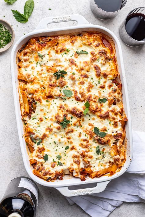 Baked Ziti with Ricotta & Sausage is the ultimate comfort food. Perfectly al dente pasta, rich, creamy ricotta cheese, savory sausage, and a flavorful red sauce, all under a blanket of melted mozzarella. It just screams Sunday supper! Be sure to stick the baked ziti under the broiler just before serving to ensure golden brown bits in every slice. Make-ahead and freezer-friendly. #wellseasonedstudio #bakedziti #sausage #ricotta #bakedpasta Baked Ziti With Sausage And Ricotta, Ricotta Sausage Pasta, Riccota Cheese Pasta, Make Ahead Pasta Bake, Make Ahead Baked Ziti, Pasta Bake With Ricotta Cheese, Sausage Baked Ziti, Baked Ziti With Italian Sausage, Creamy Baked Ziti