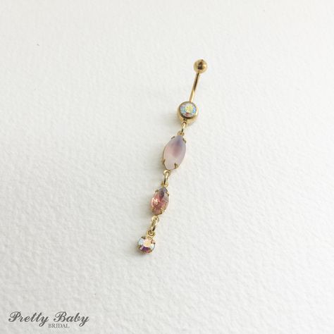 "Gold Lilac Dangle Belly Ring - opal belly ring, peach amethyst crystal navel piercing, long purple AB iridescent, bellybutton lavender  Pretty belly ring in surgical steel colored rose gold with a gem in AB With vintage and frosted glass glass crystal dangles in peach, opalescent lilac, amethyst, and iridescent AB crystals. Made with vintage glass stones from Austria and Germany, and hand set into new prong brass settings. entire piece approx 2 3/4\" long. / 7 cm 14 gauge Large barbell rhinestone approx 7mm across Comes in an organza gift bag To keep the rhinestones looking their best I recommend you do not wear this piece while swimming or bathing.  NOT RECOMMENDED FOR THOSE WITH SENSITIVE SKIN, METAL ALLERGIES, OR NEW PIERCINGS I DO NOT OFFER RETURNS or EXCHANGES, so please select caref Belly Pierce, Bellybutton Ring, Gold Belly Button Rings, Cute Belly Rings, Opal Belly Ring, Piercing Chart, Bellybutton Piercings, Belly Button Piercing Jewelry, Belly Piercing Jewelry