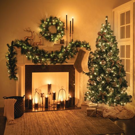 Transform your home into a winter wonderland with our stunning 6.5' Prelit Artificial Pine Christmas Tree. Perfectly designed to capture the beauty and charm of a real pine, this tree offers a hassle-free way to bring festive joy into your space. This holiday season, let this prelit tree be the heart of your celebrations. Whether you’re hosting a festive gathering or enjoying a quiet evening by the fire, this tree adds a touch of enchantment to every moment. Sullivans 6.5-ft Pine Pre-lit Artificial Christmas Tree with LED Lights | TR1245 Led Christmas Tree Lights, Prelit Tree, Pine Christmas Tree, Quiet Evening, Pine Garland, Christmas Themes Decorations, Holiday Store, Indoor Christmas Decorations, Indoor Christmas