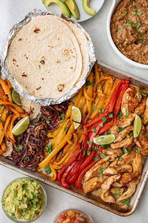 These chicken fajitas are baked in the oven on a sheet pan for a fuss free family meal that is full of flavor. Made with an easy homemade fajita seasoning. Lunch Oven Recipes, All Food Group Meals, Chicken Fajitas Sheet Pan Recipe, Fajita For A Crowd, Meal Prep Fajita Bowl, Mexican Tray Bake, Healthy Dinner Meals Families, One Pan Fajitas Chicken, Clean Eating Sheet Pan Meals