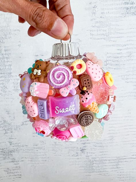 Barbie-inspired ornament that's absolutely enchanting! This little gem is sprinkled with cute charms that take me right back to my childhood dream world. Candy Charm: Because who can resist Barbie's sweet style and candy-colored world? This ornament is not just a decoration; it's a delightful trip down memory lane, reminding us to dream big, sparkle brighter, and never stop having fun! may your days be filled with joy,and a touch of Barbie magic! #BarbieOrnament #HolidayMagic #DreamBigBarbie Barbie Christmas Tree Topper, Christmas Candy Ornaments Diy, Barbie Christmas Decor, Barbie Christmas Tree, Barbie Christmas Ornaments, Christmas Kawaii, Diy Sprinkles, Barbie Christmas, Candy Balls