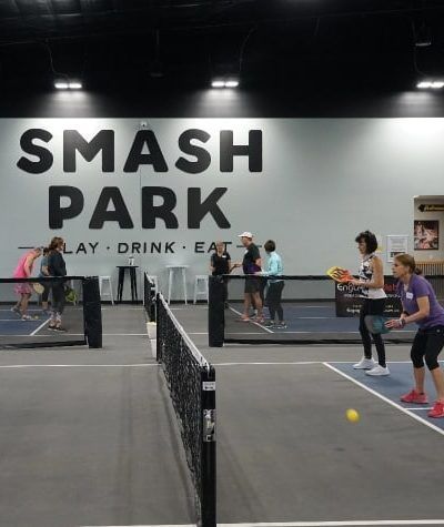 PLAY PICKLEBALL Smash Park is your one-stop shop for pickleball in West Des Moines. With 6 pickleball courts, a pro shop full of gear and sportswear, leagues and tournaments, and … Pickleball Court Design, Indoor Pickleball Court, Sport Facility, Indoor Pickleball, Pickleball Tournament, Pickleball Design, Pickleball Courts, Sport Center, Event Games