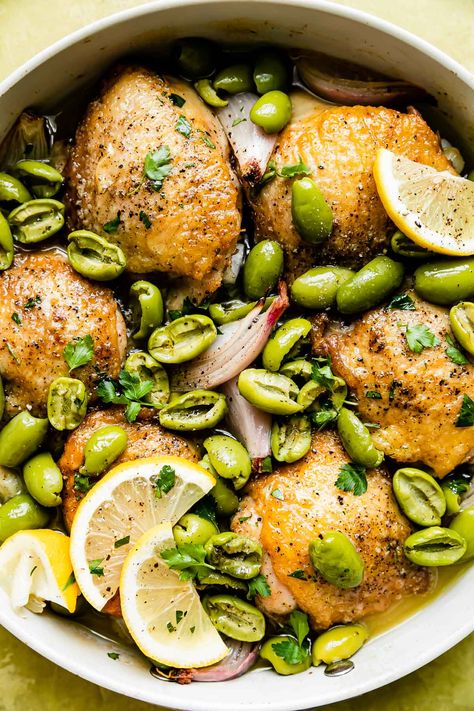 This Castelvetrano Olive Chicken Skillet is weeknight dinner magic: a 5-ingredient, one-skillet recipe ready in 40 minutes or less! Simply roast chicken thighs with olives, shallots, & lemon, which creates a rich, briny, & bright pan sauce as it cooks. Minimum effort, maximum flavor! Serve the chicken and olives with tons of fresh herbs, lemon, & crusty bread for dipping. #olivechickenrecipe #chickenolivesrecipe #chickenthighrecipe #skilletmeals #skilletchicken #easydinnerideas #dinnerrecipes Castelvetrano Olives Recipe, Chicken And Olives, Roast Chicken Thighs, Olive Chicken, Bread For Dipping, Castelvetrano Olives, Chicken Thighs Dinner, Chicken Skillet, Pan Sauce