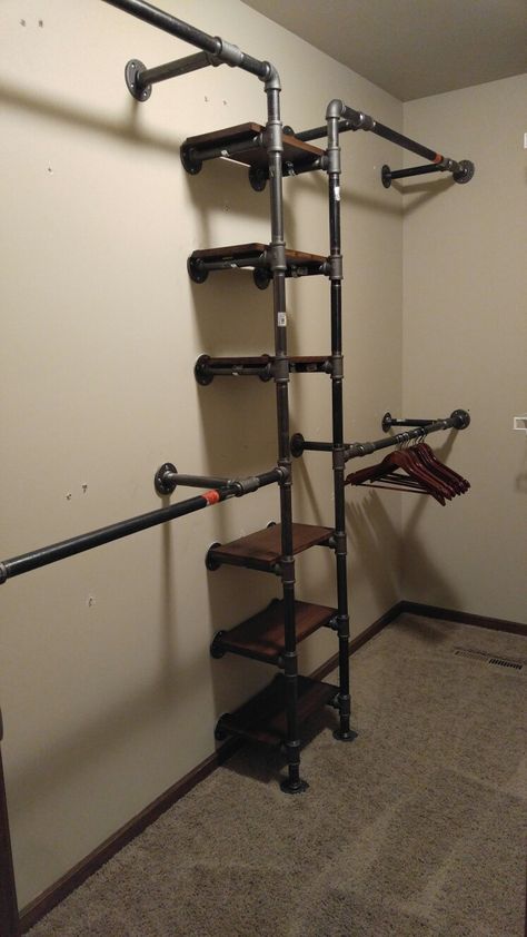 Industrial Closet Shelving, Industrial Closet Rod, Open Closet Industrial, Black Iron Closet Ideas, Bedroom Closet Paint Ideas, Black Pipe Closet Ideas, Open Hanging Closet, Industrial Walk In Closet, Brick Closet