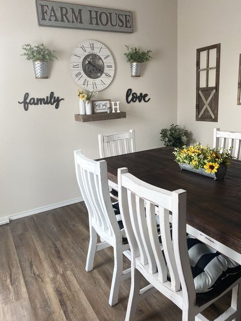 All wood White Santa table with 6 chairs. Farmhouse wall decor. Sunflower centerpiece arrangment. Black and white stripe seat cusions. Over Kitchen Table Wall Decor, Kitchen Wall Decor Ideas Behind Table, Farmhouse Decor Black And White, Kitchen Wall Decor By Table, Dinning Room Farmstyle, Black And White Kitchen Wall Decor, Wall Decor For Dining Area, Black White And Grey Kitchen Decor Ideas, Small Dining Wall Decor Ideas