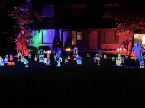 This black light graveyard using neon paints, a few black light spot lights and accent lighting makes a fun, unique Halloween display. Black Light Halloween, Halloween Blacklight, Neon Graveyard, Light Halloween, Neon Painting, Spot Lights, Halloween Outdoor, Halloween Displays, Unique Halloween