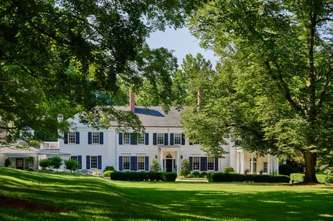 Step Inside an Impressive 19-Room Connecticut Estate | Architectural Digest | Architectural Digest Connecticut Farmhouse, Multipurpose Guest Room, Architectural Digest Magazine, Cozy Guest Rooms, New England Home, Colonial Exterior, Striped Walls, New England Homes, Grand Homes