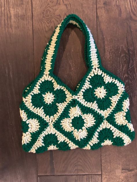 This funky bag is crocheted by hand with love. Made with 10 individual granny squares sewn together, this tote is perfect for a trip to target, a night on the town and everything in between. Every bag is carefully crafted with each customer in mind, to provide a high quality, gorgeous product.  The bag is roughly 11 by 6 inches.  Visit my storefront for more color options. Crochet Square Two Colors, 10 Granny Square Bag, Crochet Present For Grandma, Crochet Bag Granny Square Ideas, Crochet Functional Items, Crochet Bag Inspiration, Granny Squares Aesthetic, Granny Squares Projects, Crochet Patterns Green