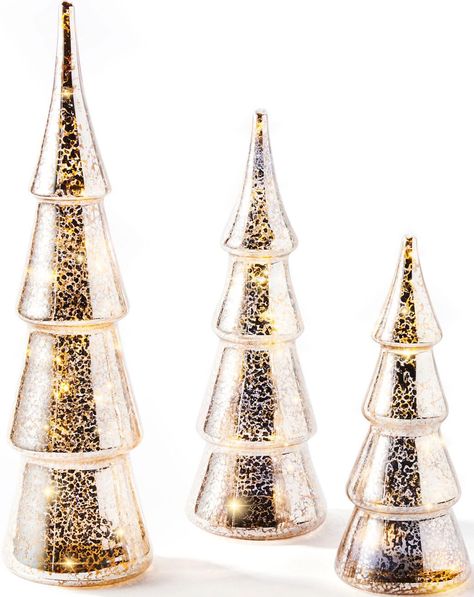 PRICES MAY VARY. ELEGANT DECOR: These three festive trees feature a vintage-style mercury glass finish. | Diameter: 4.25". | Heights: 9.5", 10" and 10.25". WARM WHITE GLOW: Each lighted tree contains LED fairy lights that adds cozy light to your tabletop or mantle. | Color temperature: 2700K. CONVENIENT TIMER - The 6 hour auto-timer feature turns the Juniper Trees on and off at the same time each day for hassle-free decor. STYLING TIPS: These shimmering silver trees will make a glam addition to Mercury Glass Lighting, Glass Christmas Trees, Mercury Glass Christmas Tree, Glass Trees, Holiday Table Centerpieces, Holiday Mantle, Light Up Tree, Led Fairy String Lights, Mercury Glass Christmas