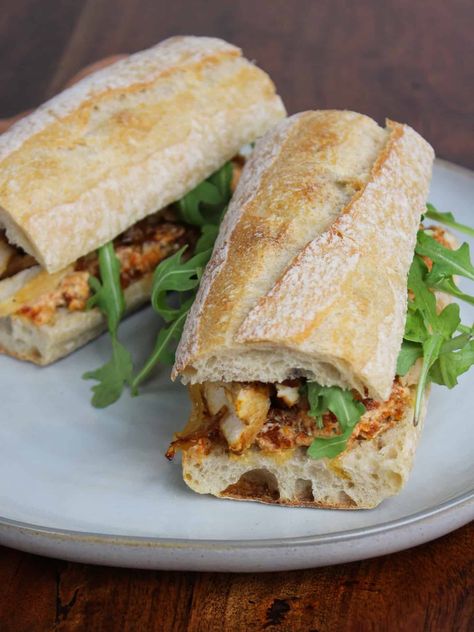 Make this fresh and healthy chicken and goat cheese sandwich with sun-dried tomatoes, caramelized onions, and arugula for a delicious lunch. Goat Cheese Chicken Sandwich, Sandwich With Goat Cheese, Chicken Arugula Sandwich, Goat Cheese Sandwich Recipes, Chicken And Goat Cheese Recipe, Chicken And Goat Cheese, Goat Cheese Chicken, Goat Cheese Sandwich, Goat Cheese Stuffed Chicken