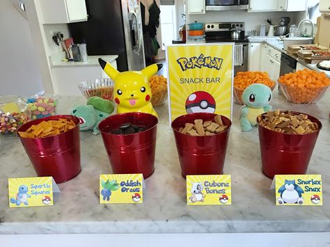 Pokemon-Themed 7th Birthday Party | Fab Everyday Pokemon Snack Bar Free Printables, Pikachu Party Food, Pokemon Food Labels, Pokemon Snack Bar, Pokemon Snacks Ideas, Pokémon Snacks, Pokemon Food Ideas, Pokemon Themed Food, Pokemon Birthday Party Games