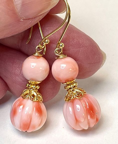 "Vintage Precious Pink Angel Skin Coral Ornately Carved Genuine Melon Beads , Handmade Bali 24K Gold Vermeil Ornate Bead Caps, Handmade Bali 24K Gold Vermeil French Ear Wires Two gorgeous vintage hand carved precious pink angel skin coral beads hang from handmade Bali 24K gold vermeil french ear wires for a delicate looking long dangling earring. The bottom carved bead measures approximately 12mm in diameter ( a bit less than 1/2\" - there are 25mm to the inch ) and has carving which is high rel Angel Skin, Coral Beads Necklace, Coral Earrings, Onyx Bead, Coral Beads, Dangling Earrings, Blue Chalcedony, Handmade Copper, Bead Caps