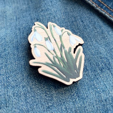 This lovely snowdrop pin badge brooch is a great little accessory for spring and for anyone how loves snowdrops and wildflowers. Making this snowdrop wooden pin a great little gift for that special someone. - ::: DETAILS ::: - * Snowdrop image * Size 40mm pin badge * Maple veneer mdf * Gloss finish * Black rubber clutch - - - - #snowdropbadge #snowdropbrooch #snowdrops #snowdropseason #whitesnowdrops #snowdropflowers #pinbadge #pinbadges #woodenpin #woodenpinbadge #flowerpinbadge #pins #etsy... Special Someone, Illustrators On Instagram, Flower Accessories, Flower Pins, Black Rubber, Pin Badges, Little Gifts, Wild Flowers, Drawings