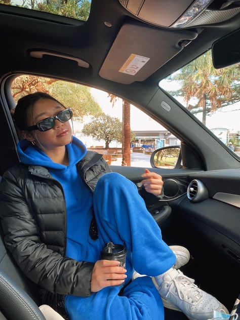 Girl in blue tracksuit on coffee run sitting in car Tracksuit Outfit Women Street Styles, Blue Joggers Outfit, Tracksuit Aesthetic, Cobalt Blue Outfit, Blue Hoodie Outfit, Tracksuit Outfit Women, Blue Tracksuit, Tracksuit Outfit, Joggers Outfit