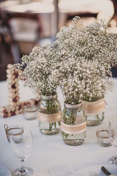 Baby’s breath has a gentle country charm. Place them in mason jars wrapped in ribbon and burlap for full effect. Amazing Wedding Centerpieces, Rustic Wedding Details, Wedding Centerpieces Mason Jars, Cheap Wedding Decorations, Breath Flowers, Rustic Wedding Decorations, Country Wedding Decorations, Mason Jar Wedding, Rustic Wedding Centerpieces