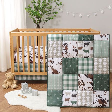 Home is where the herd is thanks to the boho farm 3-piece bedding set by the peanutshell. This collection features a classic cow print and rich forest green patchwork that seamlessly blend modern farmhouse with traditional elements. The set includes a standard fitted crib sheet with strong elastic, a 32" x 41" quilt, and a traditional check crib skirt for a tailored finish. The charming collection brings a touch of contemporary rustic to your nursery. For easy care, wash on a cold, gentle cycle Farm Nursery Theme, Farmhouse Bedding Sets, Nursery Crib Bedding, Cow Nursery, Crib Comforter, Modern Bed Set, Baby Crib Bedding Sets, Baby Crib Sheets, Bassinet Sheets