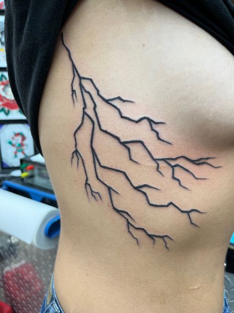 Lightning Bolt Rib Tattoo, Lightning Bolt Tattoo Rib Cage, Tattoo Ideas Female Lightning, Lightning Side Tattoo, Lighting Tattoo Design Women, Lightning Bolt Tattoo Women, Thunderstorm Tattoo Women, Ride The Lightning Tattoo, Lightnight Bolt Tattoos