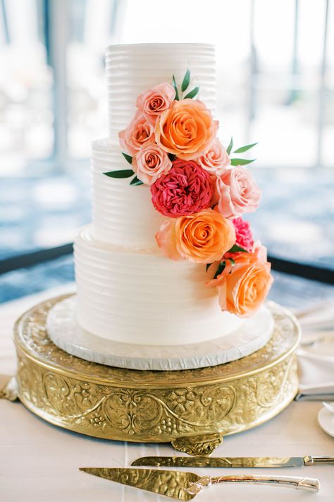 Wedding Cakes With Flowers Cascading, Orange Flower Wedding Cake, Wedding Cake 3 Tier Flowers, Orange And Pink Wedding Cake, Wedding Cake Coral Flowers, 3 Tier Cake With Flowers, 3 Tier Wedding Cake With Flowers, Cascading Flower Cake, Sunset Wedding Cake