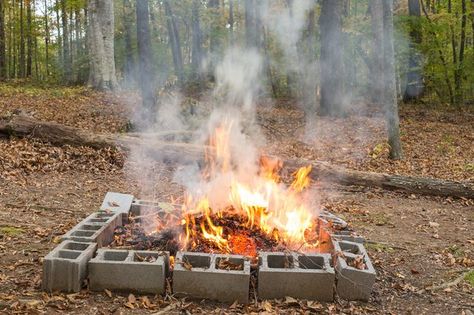 How to Burn Yard Waste - With the right preparation, careful location and proper dousing, you can burn effectively without letting the fire get away. Wood Floor Stains, Burn Barrel, Cinder Blocks, Protecting Yourself, Gardening Gear, Stone Fire Pit, Safety Precautions, Yard Waste, Garden Fire Pit